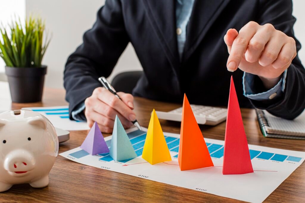 front-view-businessman-with-colorful-cones-representing-growth